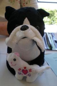 Larry couldn't be there, but someone sent a proxy (via acme.)  Puppy-Larry attended several panels and was incisive.  Then he found a kitten to cuddle.  Cats and dogs sleeping together...  you know the drill.